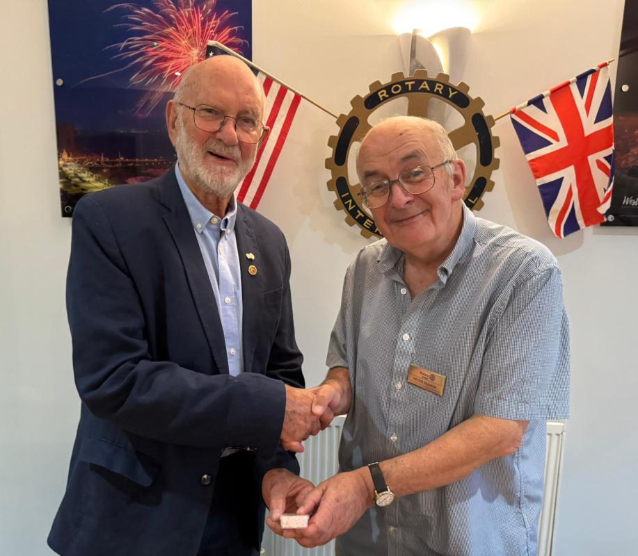 President Peter presents the award to PP Bernard