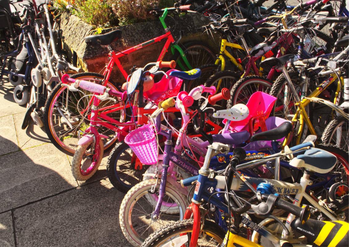 Collected stack of bicycles awaiting collection