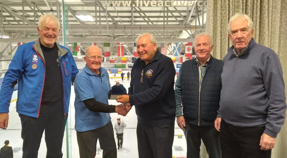 Presentation of the Rotary Jewel Trophy to the skip of the Rotary Club of Forfar rink