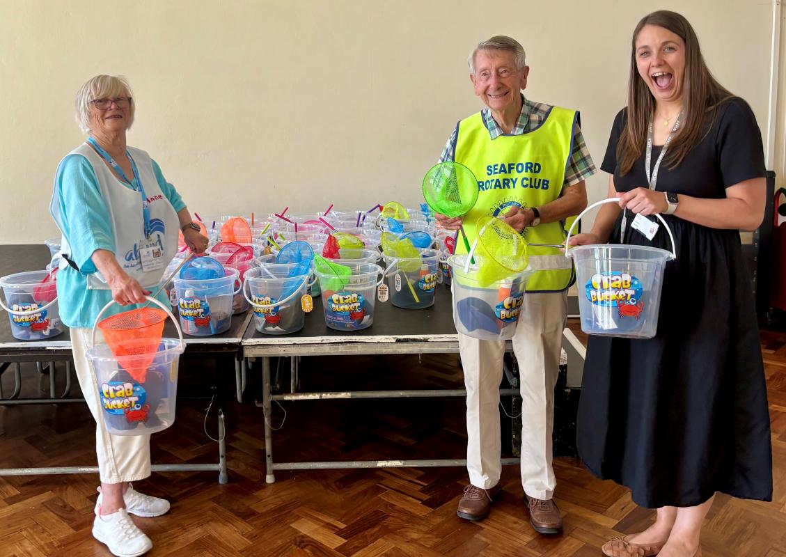 Ann Bickmore, BEM Chair of the abcfund charity, Jim Anderson and Amy Clarke, Chyngton Primary School Headteacher, with the “Buckets of Sunshine”