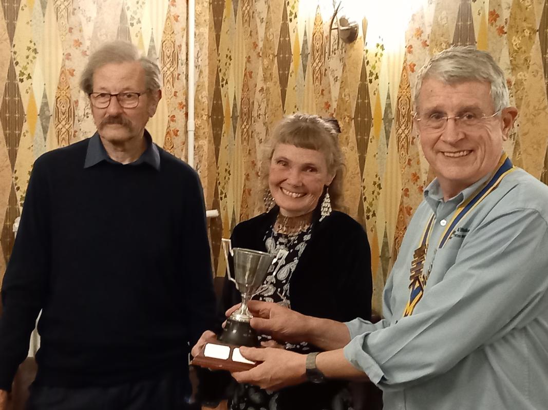 Keith and Caroline receive  trophy from President Andrew Barwood