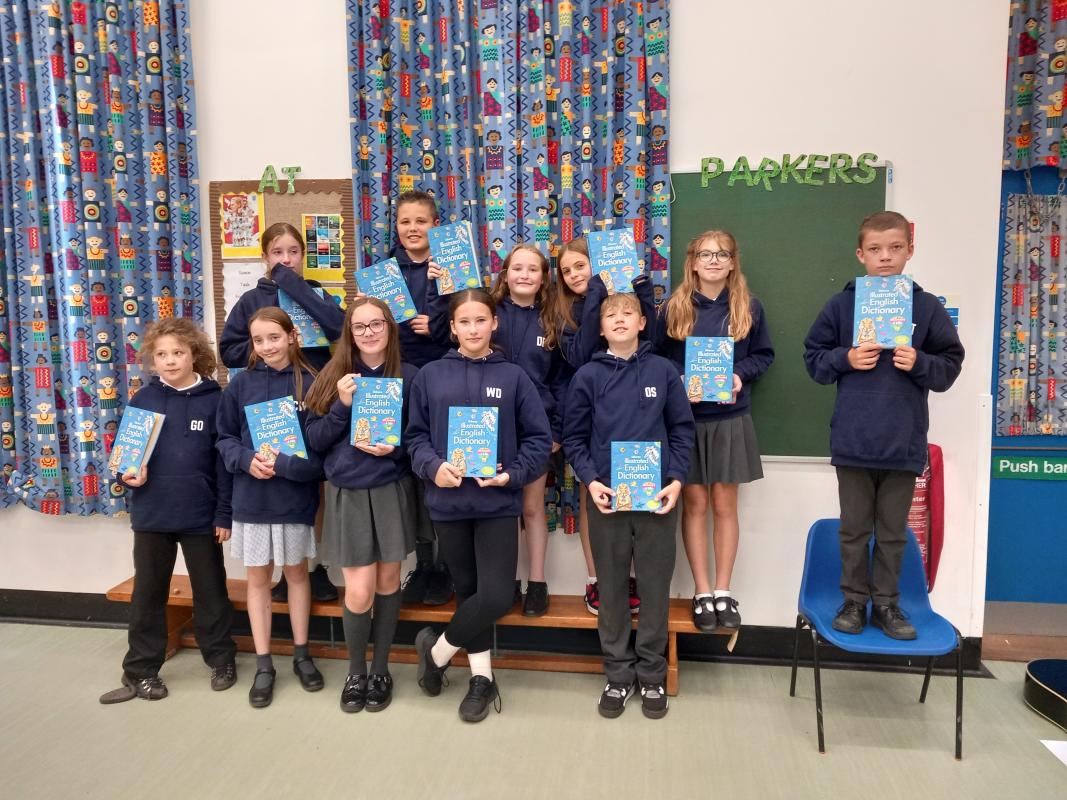 Pupils at Parkers School in Saham Toney with their dictionaries