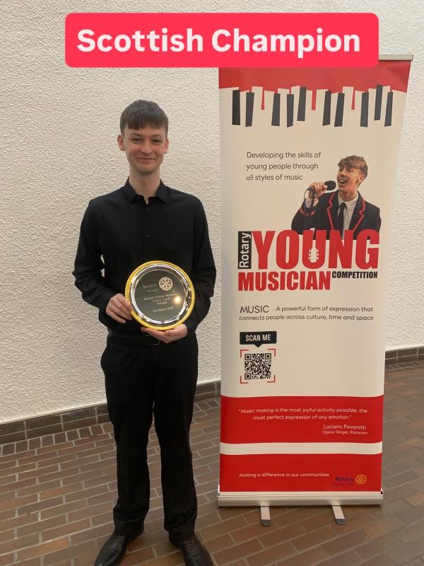 Dylan Wallace with his trophy as Scottish Rotary Young Vocalist