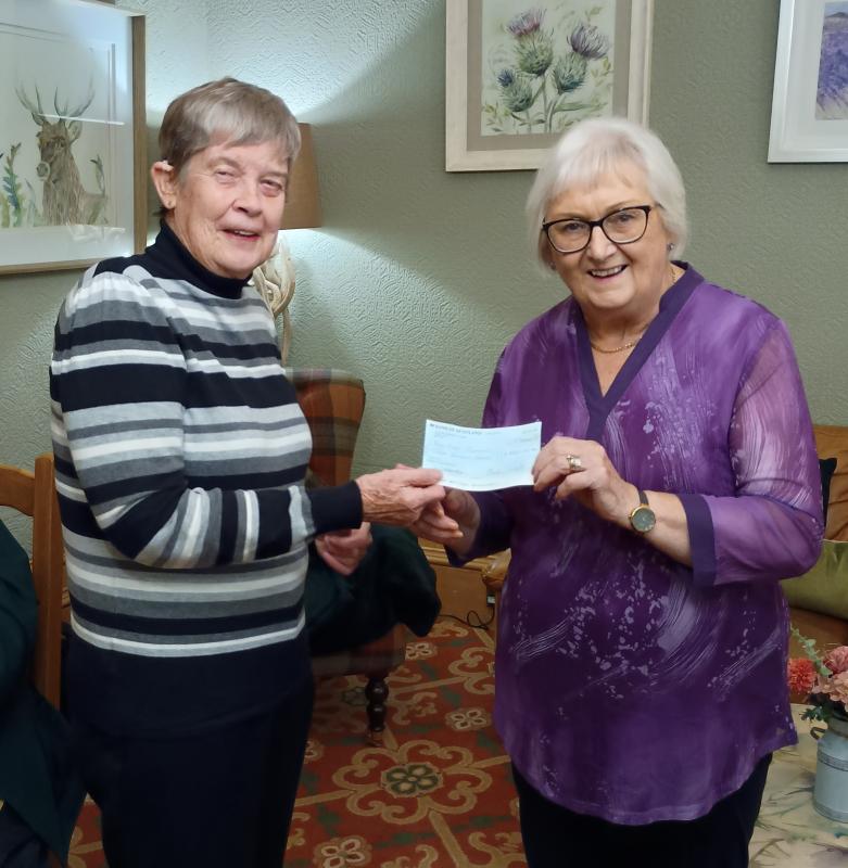 President Mairhi presents a £300 cheque to Maria Walker