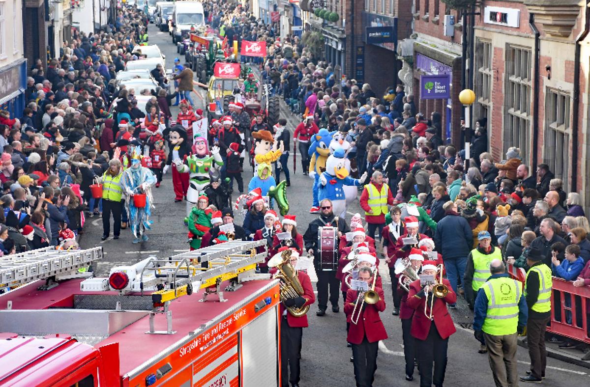 The Christmas Parade heads through Oswestry as the marching band plays