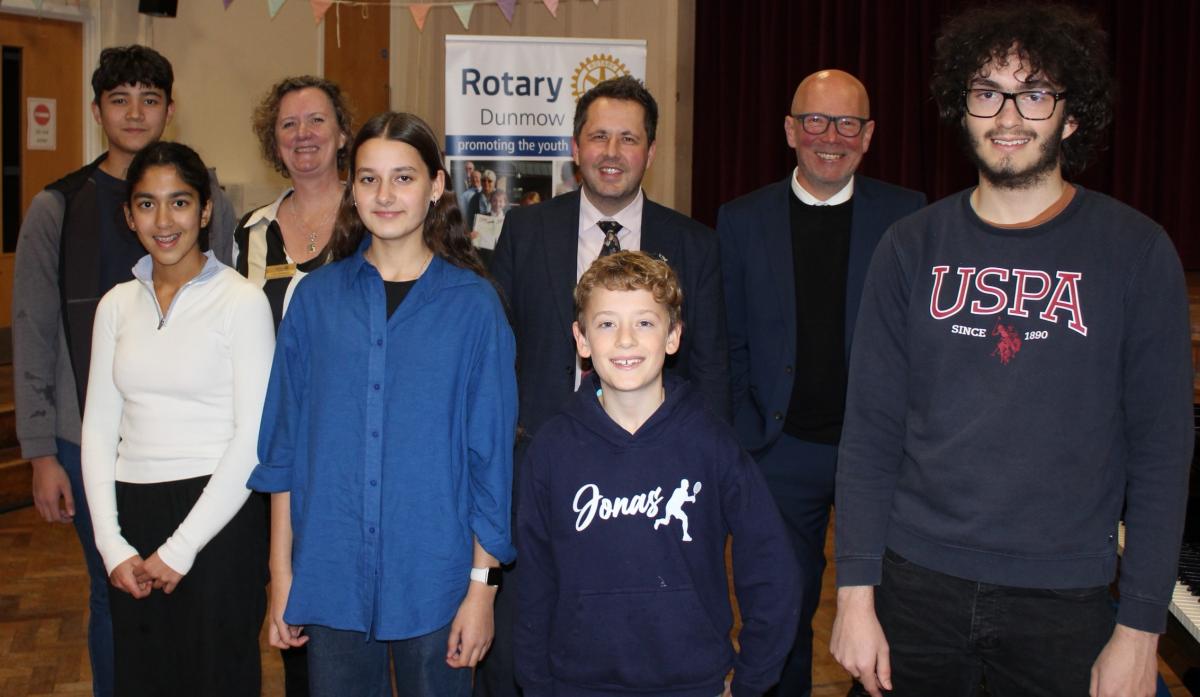 Some of this year's Dunmow Rotary Young Musicians with Lois Sparkes, chair of the Dunmow Rotary Youth committee and President-elect with judges James Cairns & Philip Sunderland.