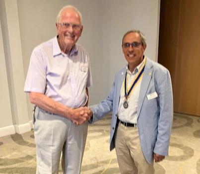 Retiring Kenilworth Rotary President Maurice Holden hands over to the 2025/26 President Steve Krikler