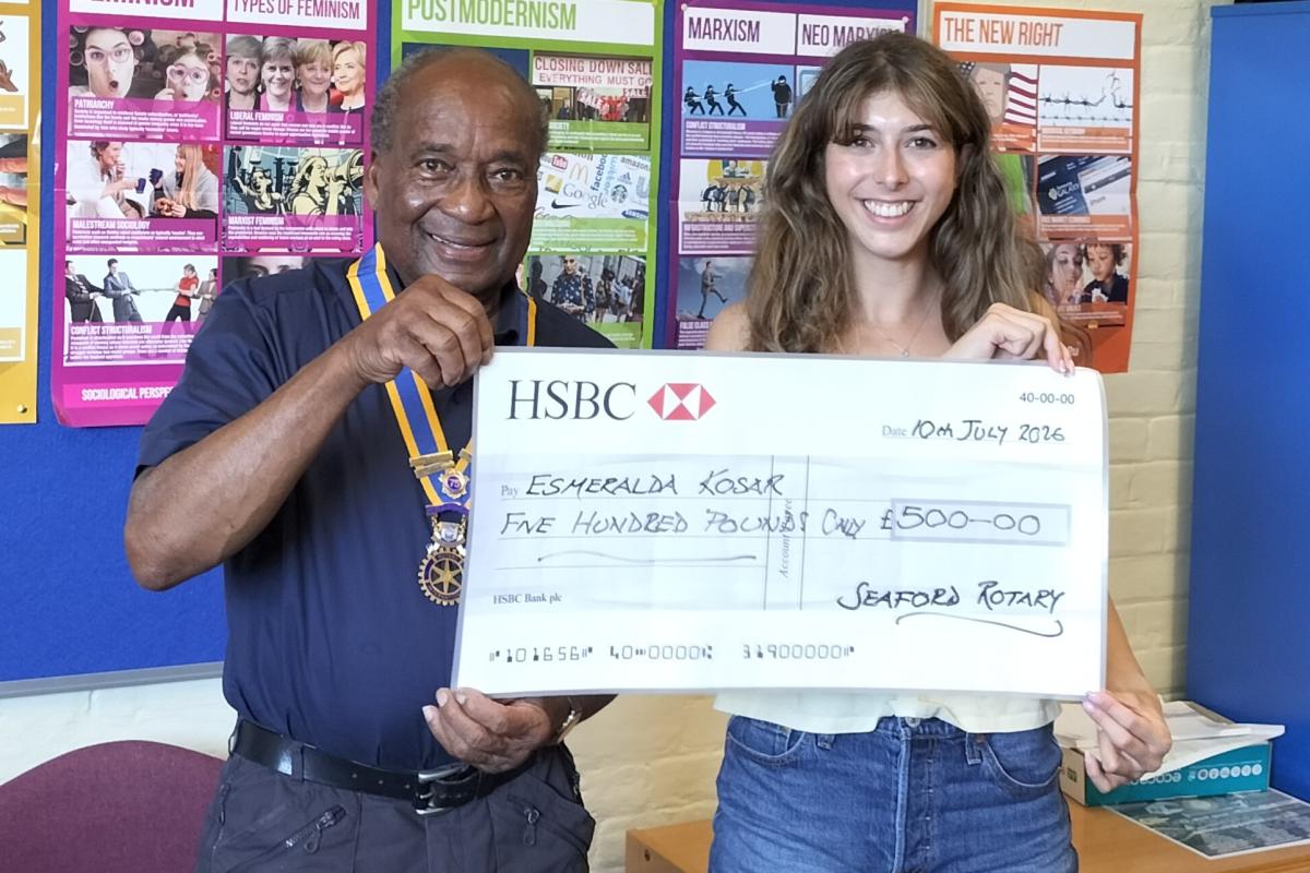 Esme Kosar receiving the grant cheque from President Collins Griffith
