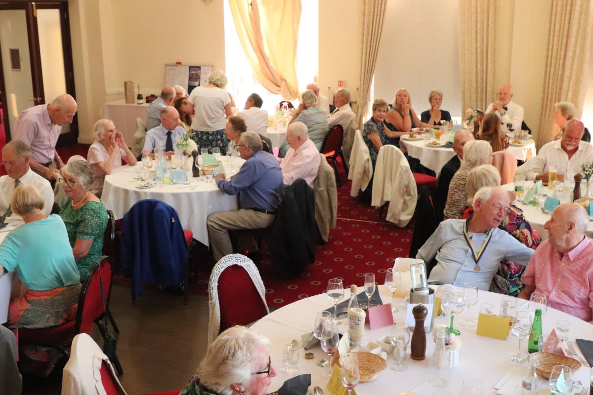 Members and their guests waiting for the dessert to be served