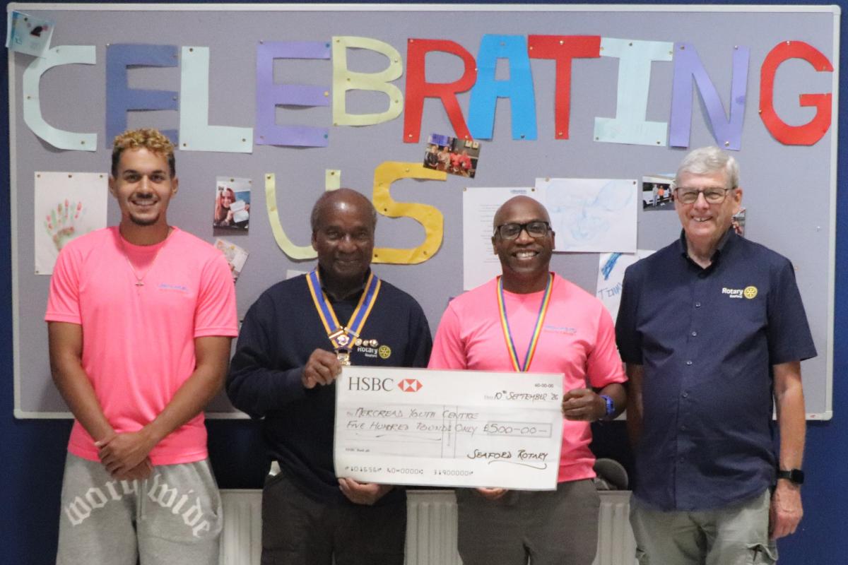 From the left:  Kingsley Savin-Sims, President Collins Griffith, Jason Savin, Youth Services Manager and Paul Vaesen, Chair of Youth Services Committee