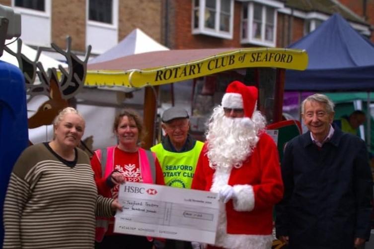 From the left:  Vicki Scippings, Seaford Chamber of Commerce, Miranda Bearns-lowles, Frank Thompson, Santa Claus and Jim Anderson