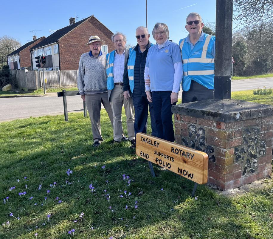 Rotarians adding the sign, kindly made by the men's shed