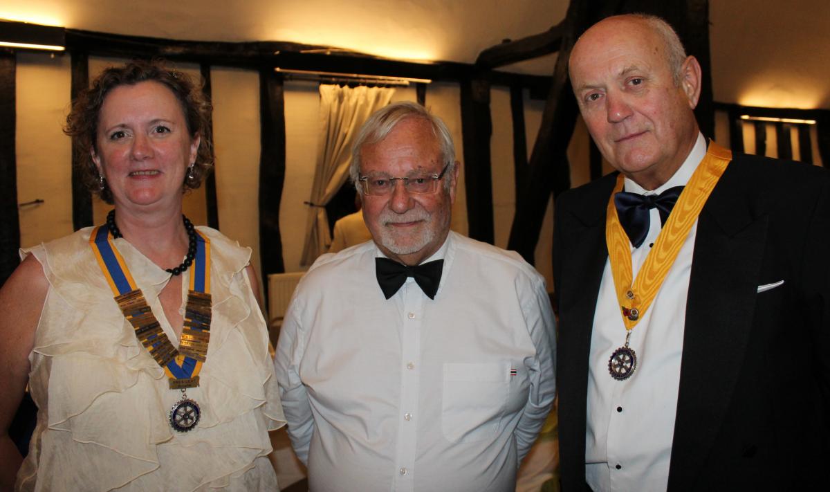 Barry Clark seen with the new club President Lois Sparked and President-elect David Hipkin.