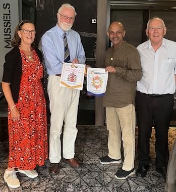 President peter exchanging banners with Walter George, Immediate Past President of the Rotary Club of Film City, Bombay (Mmbai), India