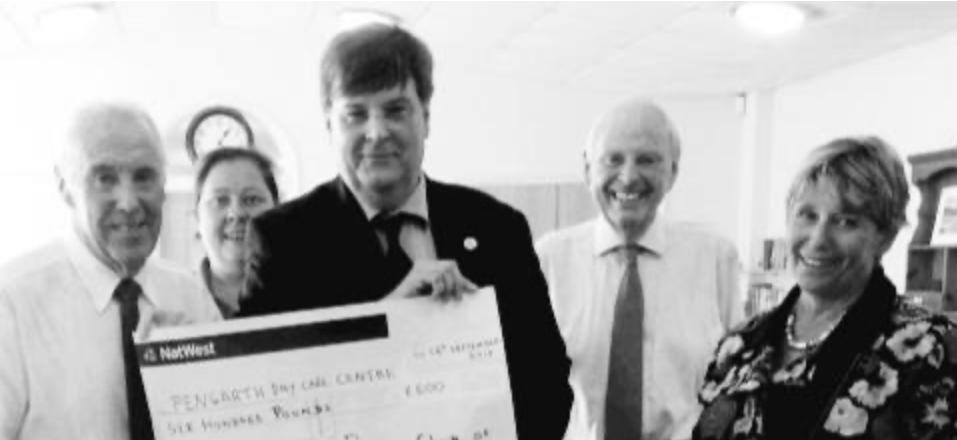 Penzance Rotary President Matt Martens presents funds to Pengarth Trustee Eric Parton.