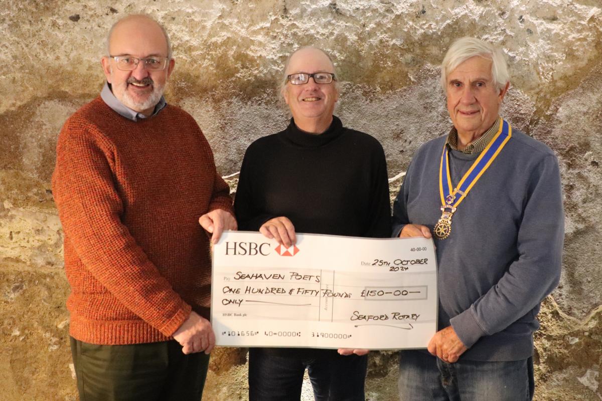 President Clive Livingstone with Community Service Chair Rodney Reed presenting the cheque to Seahaven Poet Christopher Goode