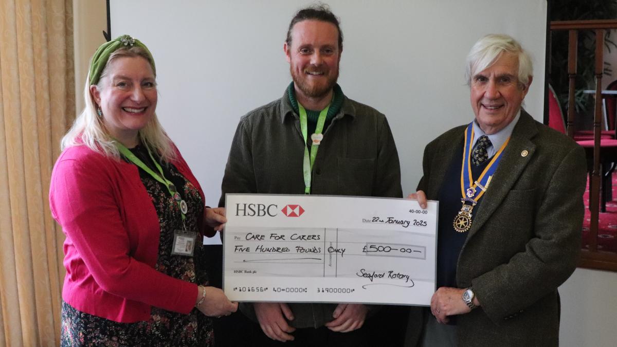 The donation being presented to Sammy Revill and Dan Hermitage from Care for The Carers by President Clive Livingstone