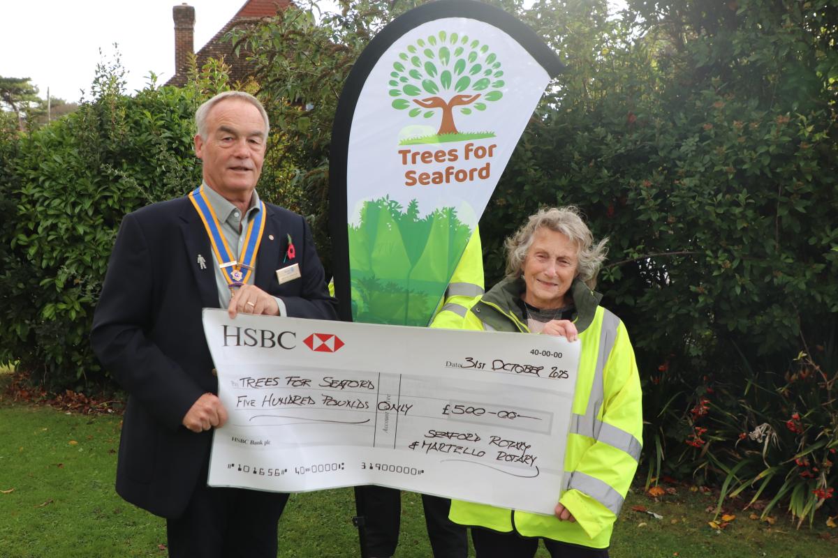 President Mike Barker presenting the grant cheque to Jean Loveland from Trees for Seaford 