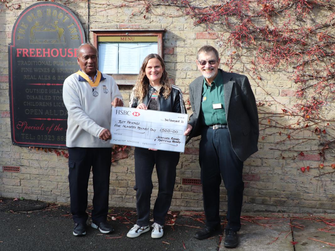Vice President Collins Griffith and Tony Humphreys from Seaford Martello Rotary Club presenting the grant cheque to Jeanette Thompson from the charity Just Friends