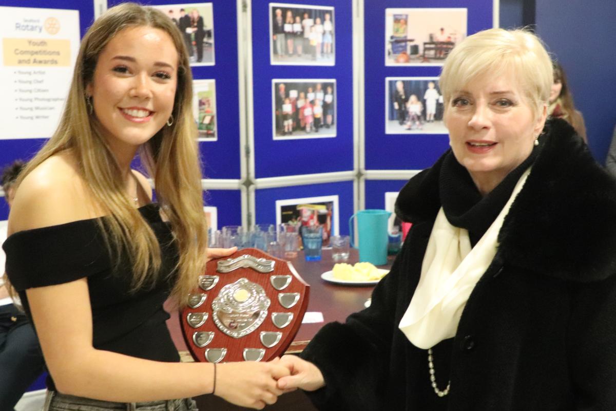 Nia Waite being presented with the Philip Moorey Young citizen of the Year award by Elaine Moorey