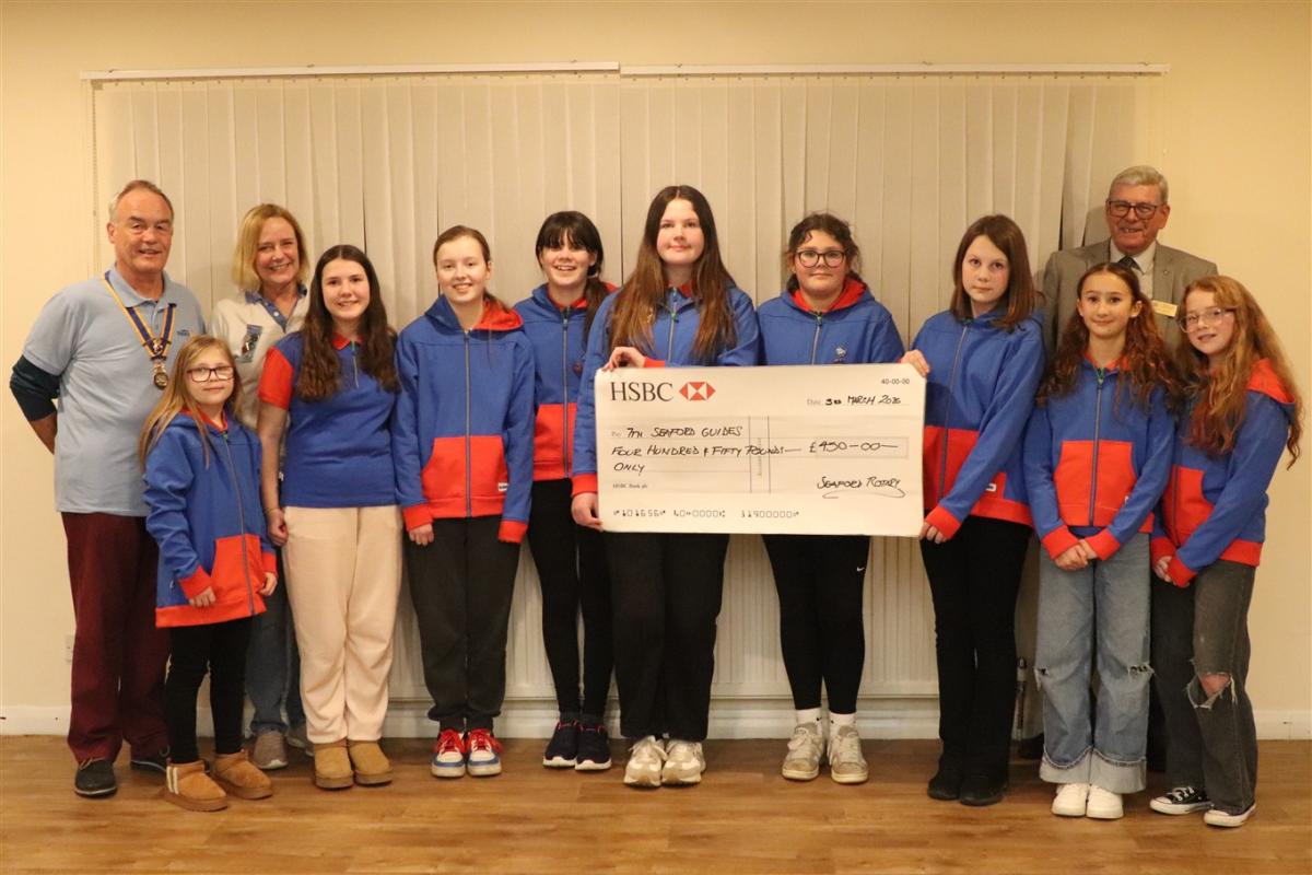 The Girl Guides who will be attending Olave with, on the left, President Mike Barker, Guide Leader Wendy Fortune and Paul Vaesen Chair of Youth Services Committee.