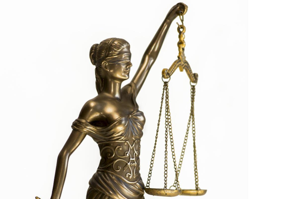 Top half of bronze figure of Justice.