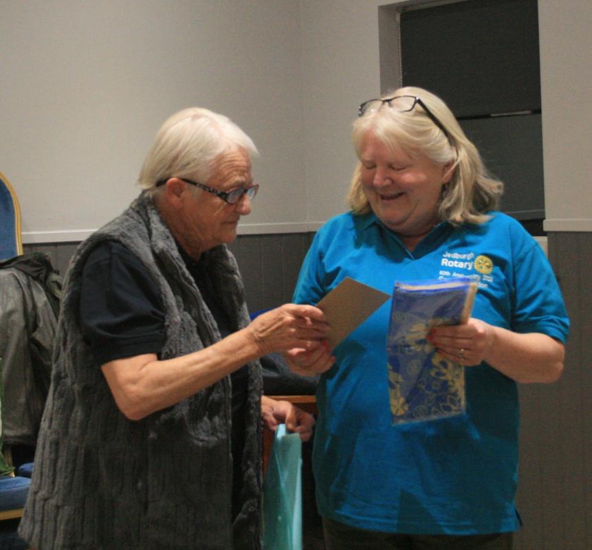 President Margaret with Caroline presenting a Rotary scarf and pin