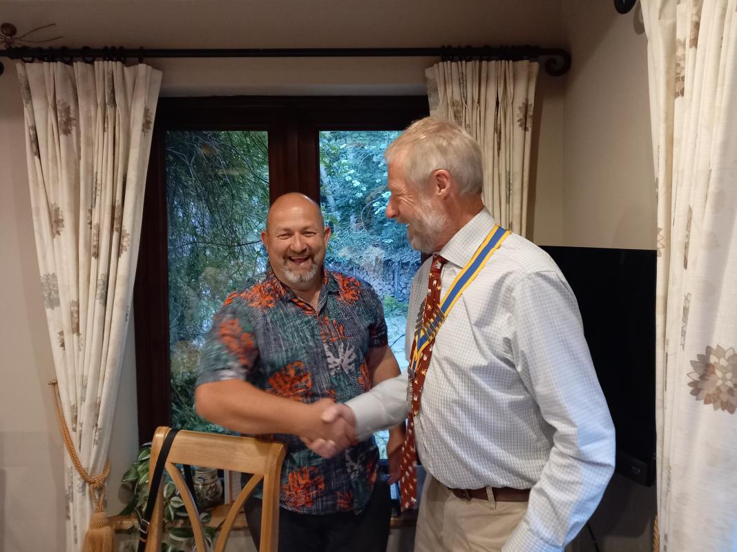 Francis Ulrych (right) is congratulated by a relieved looking outgoing president Shaun Yeoman