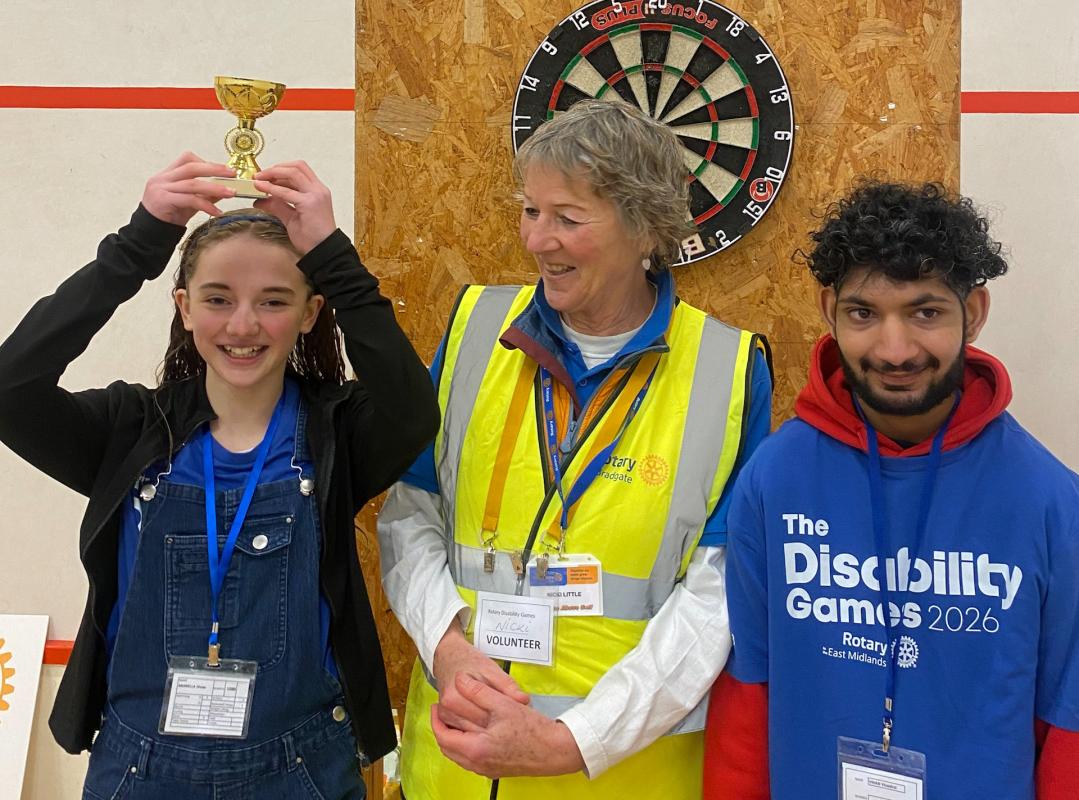 President Niki Little presenting prizes at the darts competition in April 2026