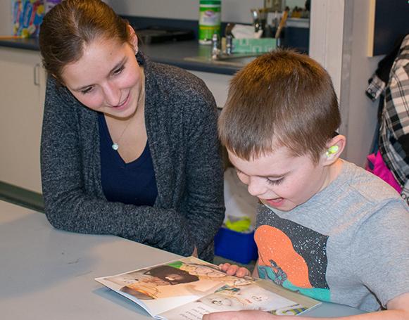 Volunteers of the Reading Buddies scheme which operates in many countries  (photo not of Dartmouth schools)