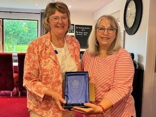 Rotarian Linda Facey with her award and President Martyn with Jason Isaacs
