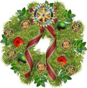 A Christmas wreath with a Rotary wheel in it.