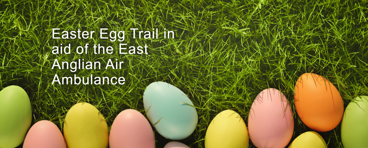 Easter eggs laying on the grass, inviting you to an Easter Egg Hunt