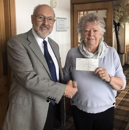 Phil presents cheque to Marj Wilkinson