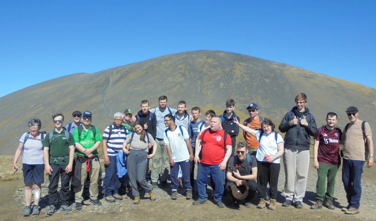 Summit to be proud of… the entire team with Skiddaw in the background