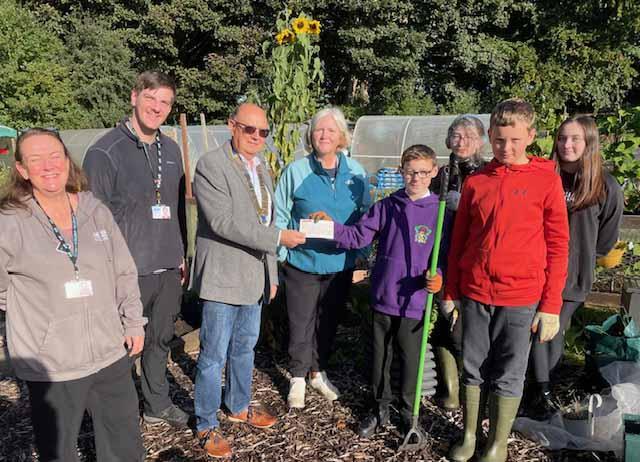 President Derek Porter handing the £400 TRCS cheque to the students of Marr College Fullerton Allotment Project. Also pictured are Teachers Scott Davidson, Jill Scott and Kathy Busby of Thriving Communities SAC