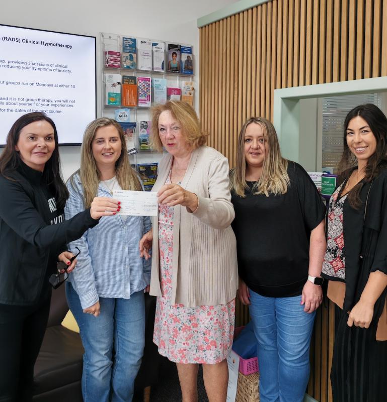 Tricia presenting the cheque