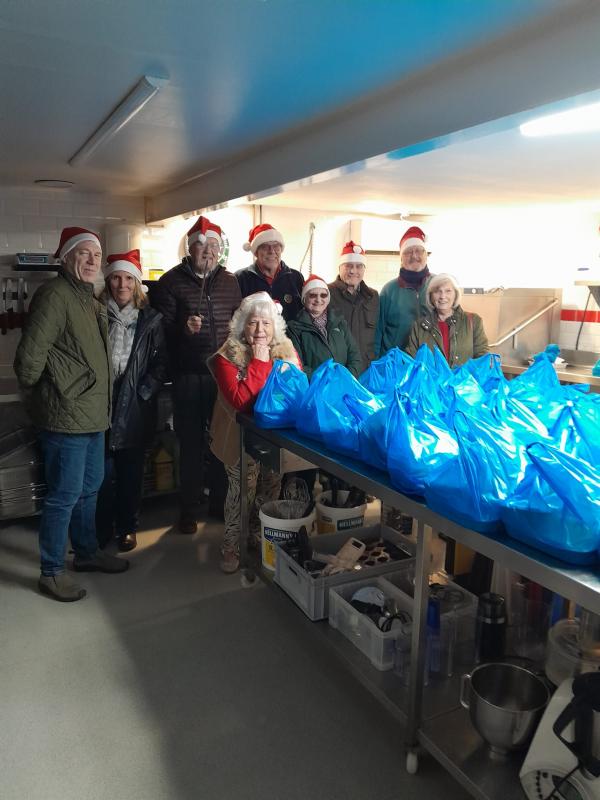 Rotarians and friends prepare to deliver 60 Christmas lunches