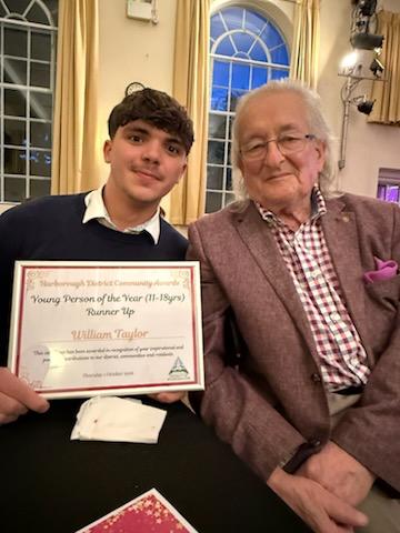 Will with his award certificate, supported by Rotarian Gordon 