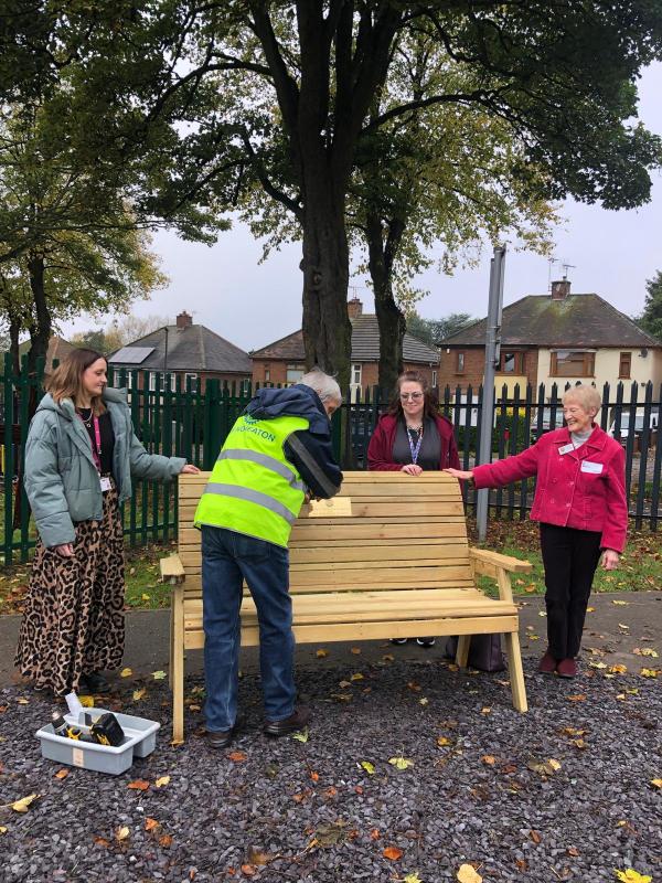 Attaching plaque to bench at st.Anne's  this morning.