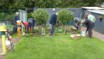 Men at work planting bulbs
