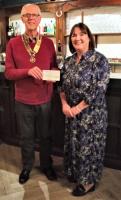 President David Brown presenting a cheque  to CVS CEO Debbie Gibbon at their monthly social gathering (3rd Tuesdays) at The Pheasant Inn, Admaston. 