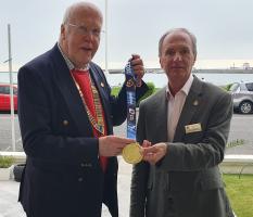 President Peter Sherred with Ray Johnson and his his 25th medal for completing the London Marathon