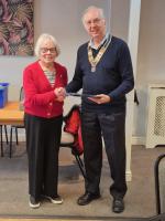 Joyce Davey receiving her Paul Harris Fellowship certificate