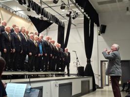 Rtn. Gareth Whitcombe conducting the Treorchy Male Choir on 29 November 2025 