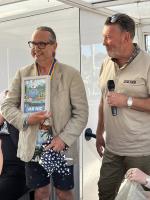 Retiring President Nic Abbott, left,  receives a parting gift from incoming President John Watson onboard the Lady Diana on the River Dee, June 2025.