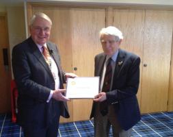 President Alastair Dorward presenting Alan Calderwood with a Paul Harris Fellowship