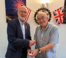 President Peter presents the award to PP Bernard