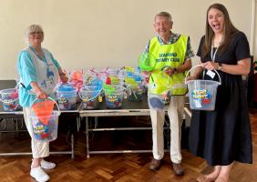 Ann Bickmore, BEM Chair of the abcfund charity, Jim Anderson and Amy Clarke, Chyngton Primary School Headteacher, with the “Buckets of Sunshine”