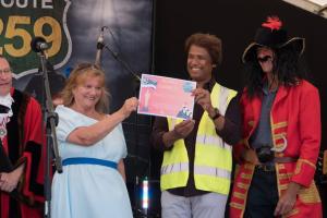 Bexhill Rotary Club President Sue Day receives the award for the Spectator's choice for our float